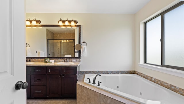 76704 E Timothy Ln, Kennewick, WA 99338 - bathroom with plenty of natural light, a stall shower, a tub with jets, and double vanity