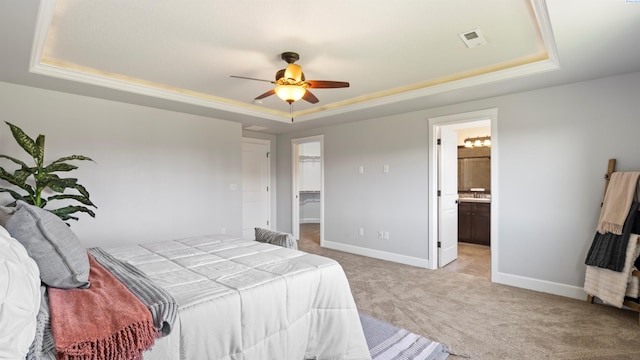 76704 E Timothy Ln, Kennewick, WA 99338 - bedroom with a tray ceiling, light carpet, baseboards, and a spacious closet