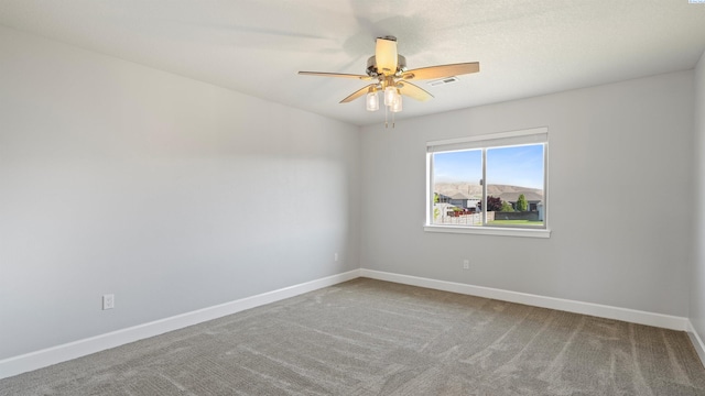 76704 E Timothy Ln, Kennewick, WA 99338 - empty room featuring baseboards, a ceiling fan, and carpet flooring