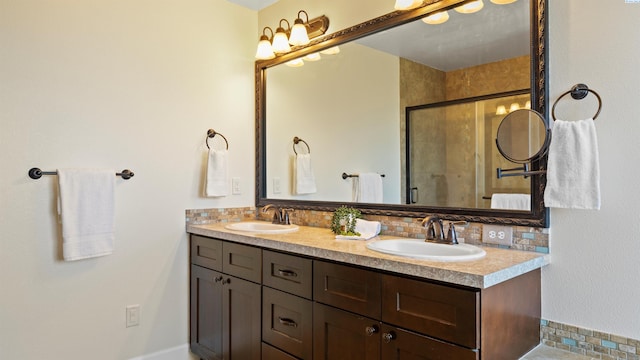 76704 E Timothy Ln, Kennewick, WA 99338 - full bathroom featuring double vanity, decorative backsplash, and a tile shower
