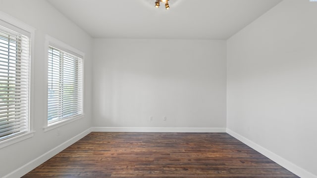 76704 E Timothy Ln, Kennewick, WA 99338 - empty room featuring plenty of natural light, baseboards, and dark wood finished floors