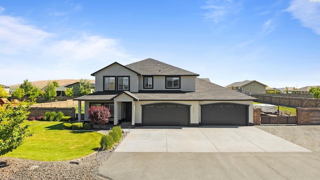 76704 E Timothy Ln, Kennewick, WA 99338 - view of front of home featuring concrete driveway, stucco siding, a shingled roof, and an attached garage