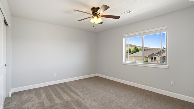 76704 E Timothy Ln, Kennewick, WA 99338 - unfurnished room featuring carpet floors, ceiling fan, and baseboards