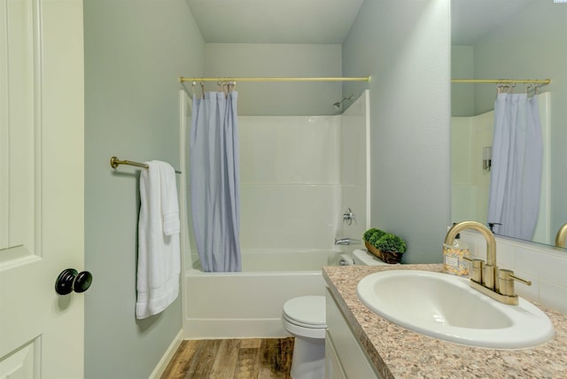 3915 Charleston Ln, Pasco, WA 99301 - bathroom featuring vanity, shower / bath combo with shower curtain, and wood finished floors