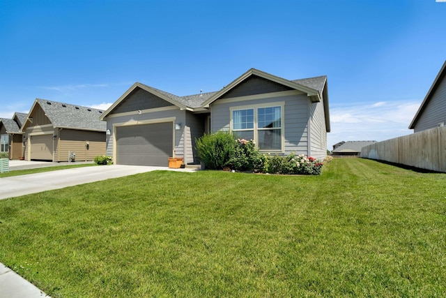 3915 Charleston Ln, Pasco, WA 99301 - ranch-style home with an attached garage, concrete driveway, and roof with shingles