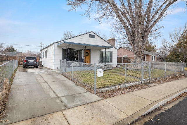 view of front of house featuring a front yard and a porch