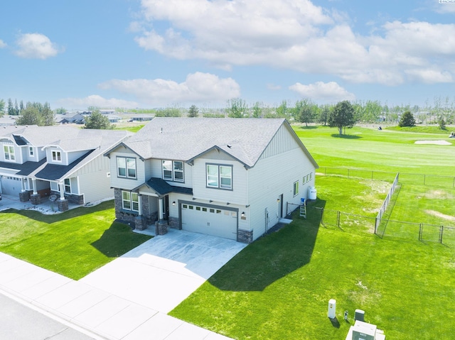 4268 Hedman Ct, Moses Lake, WA 98837 - view of front of house featuring board and batten siding, an attached garage, stone siding, and driveway