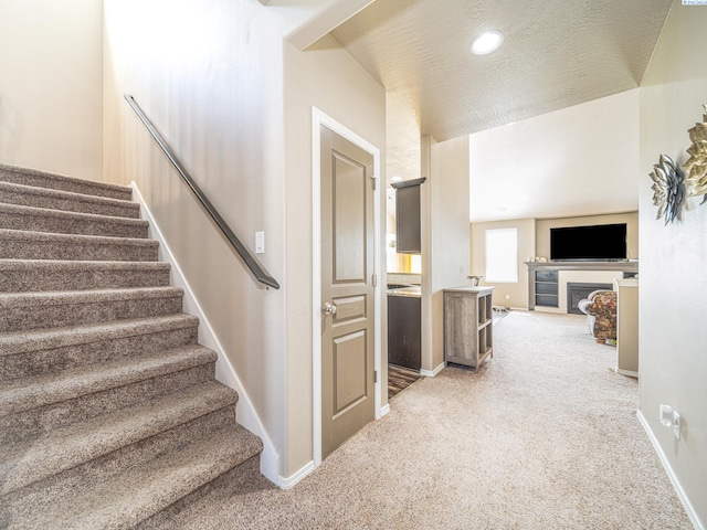 4268 Hedman Ct, Moses Lake, WA 98837 - stairway with carpet flooring and a fireplace