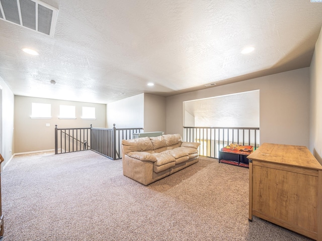 4268 Hedman Ct, Moses Lake, WA 98837 - sitting room with carpet, a textured ceiling, an upstairs landing, and recessed lighting