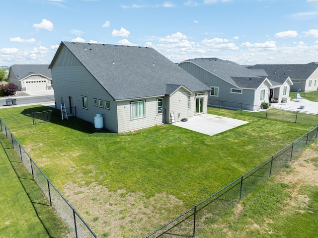 4268 Hedman Ct, Moses Lake, WA 98837 - rear view of house with roof with shingles, a patio area, and a fenced backyard