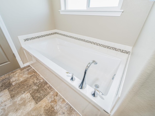 4268 Hedman Ct, Moses Lake, WA 98837 - bathroom featuring a bath and stone finish floors