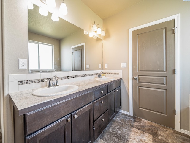 4268 Hedman Ct, Moses Lake, WA 98837 - full bathroom featuring double vanity, stone finish floors, and backsplash