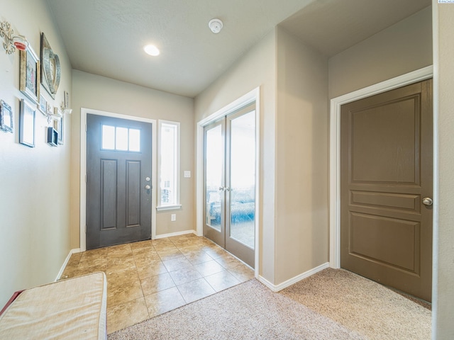 4268 Hedman Ct, Moses Lake, WA 98837 - entryway featuring french doors, recessed lighting, light tile patterned flooring, and light carpet