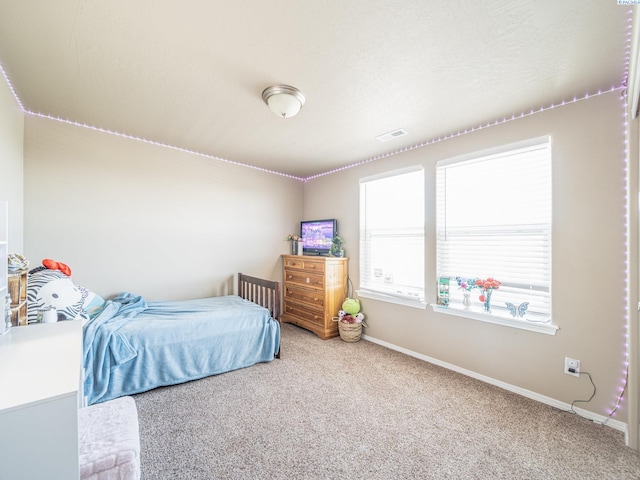 4268 Hedman Ct, Moses Lake, WA 98837 - bedroom featuring carpet flooring and multiple windows