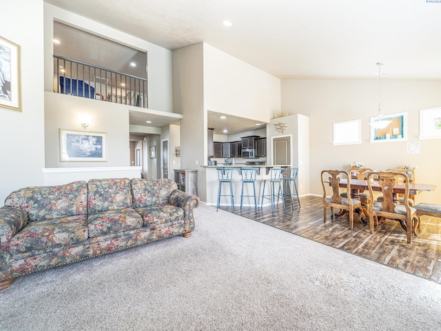 4268 Hedman Ct, Moses Lake, WA 98837 - living room featuring carpet, high vaulted ceiling, and recessed lighting
