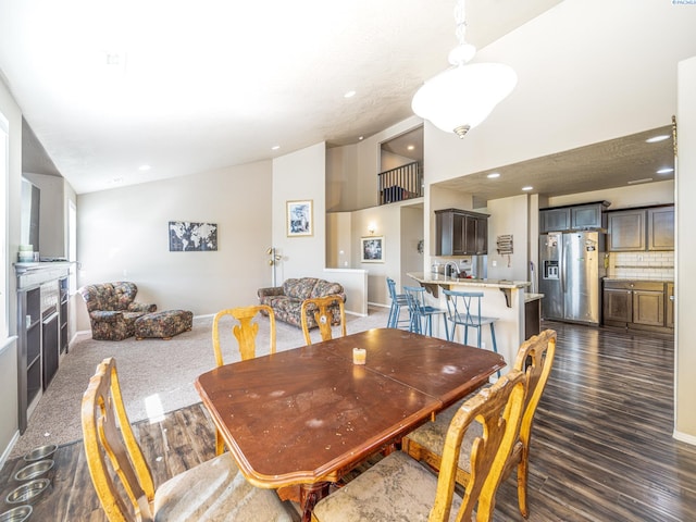 4268 Hedman Ct, Moses Lake, WA 98837 - dining area with dark wood finished floors, a fireplace, recessed lighting, and high vaulted ceiling