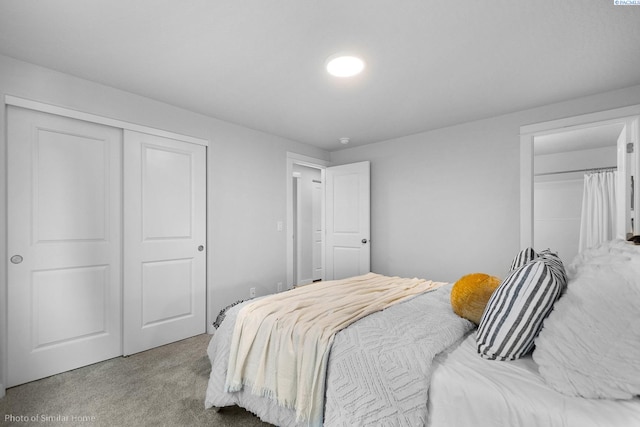 carpeted bedroom with a closet