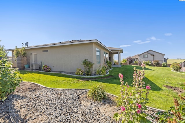 540 Athens Dr, West Richland, WA 99353 - view of home's exterior with a yard and stucco siding