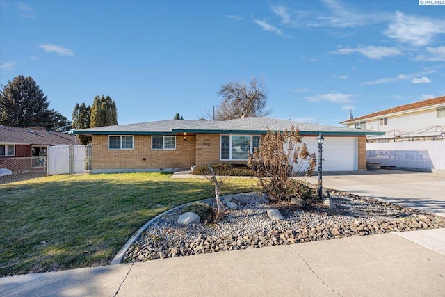 ranch-style home featuring a garage and a front lawn