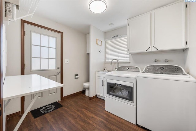 washroom featuring sink, washing machine and clothes dryer, and dark hardwood / wood-style flooring