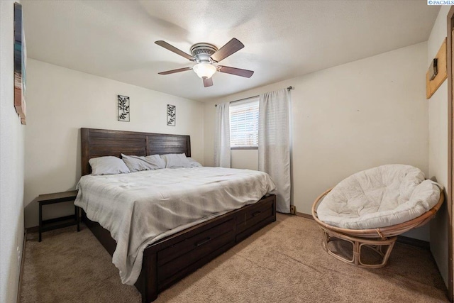 bedroom featuring ceiling fan and light colored carpet