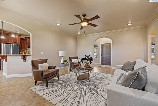 4617 W Dradie St, Pasco, WA 99301 - living area with arched walkways, a ceiling fan, light tile patterned floors, crown molding, and recessed lighting