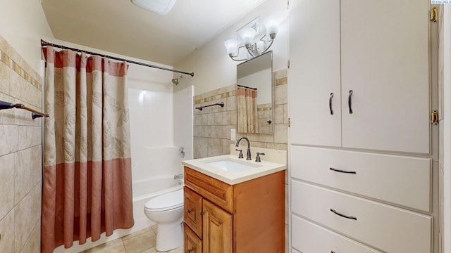 bathroom featuring tile walls, shower / bathtub combination with curtain, toilet, vanity, and tile patterned flooring