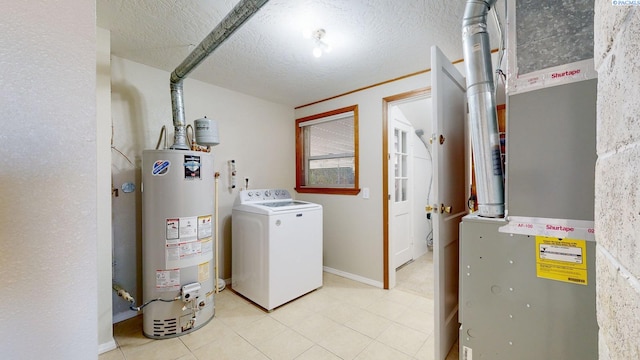 laundry area featuring a textured ceiling, gas water heater, laundry area, heating unit, and washer / clothes dryer