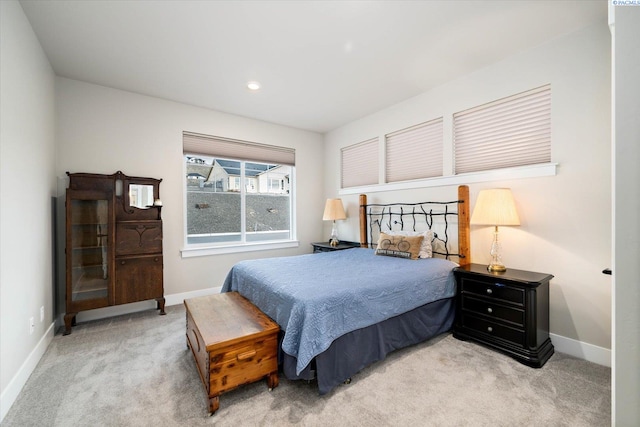 bedroom featuring light colored carpet