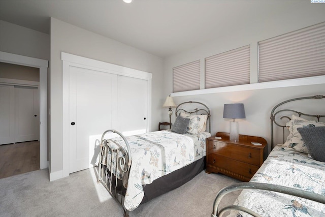 carpeted bedroom featuring a closet