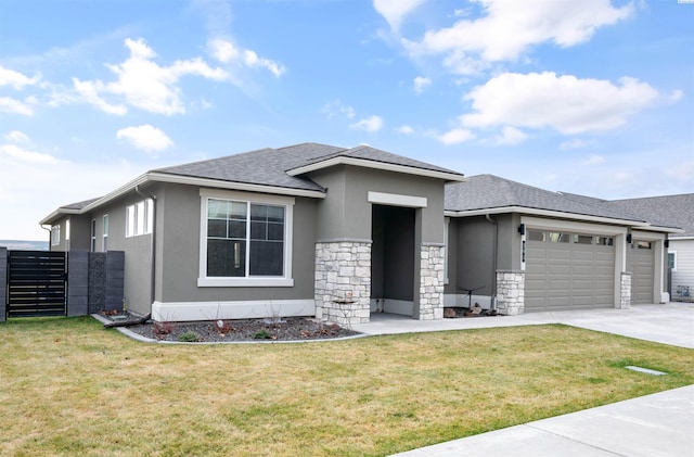 prairie-style home featuring a garage and a front yard