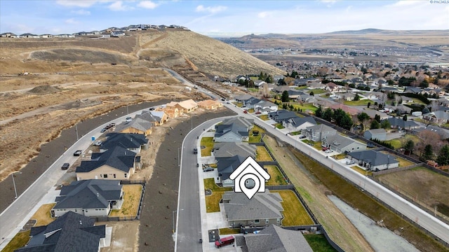 birds eye view of property featuring a mountain view