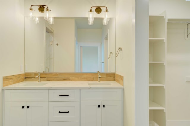 4003 Rd 96, Pasco, WA 99301 - bathroom with double vanity, a spacious closet, and a stall shower