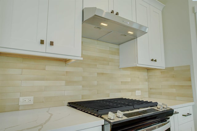 4003 Rd 96, Pasco, WA 99301 - kitchen featuring under cabinet range hood, stainless steel gas range, decorative backsplash, and white cabinets