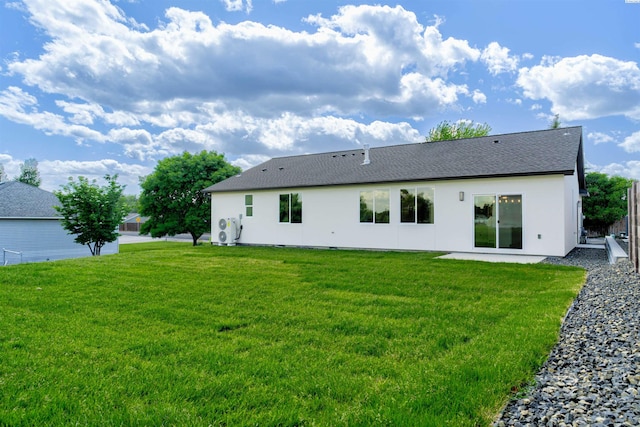 4003 Rd 96, Pasco, WA 99301 - rear view of property with a lawn, stucco siding, and roof with shingles