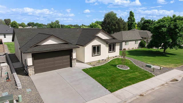 4003 Rd 96, Pasco, WA 99301 - view of front of property with a shingled roof, stucco siding, stone siding, concrete driveway, and a front lawn