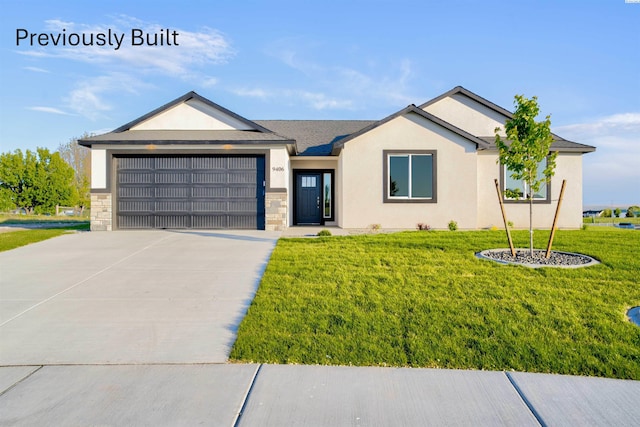 ranch-style home featuring stucco siding, a garage, concrete driveway, and a front yard