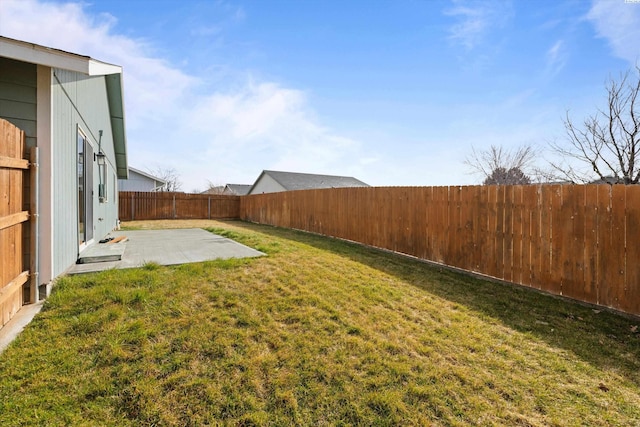 view of yard featuring a patio area and a fenced backyard