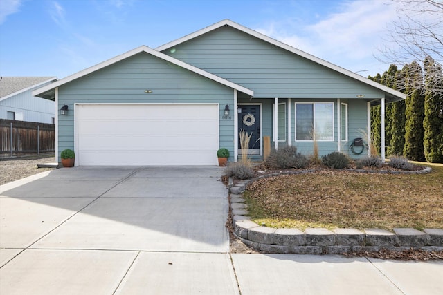 single story home featuring driveway, an attached garage, and fence