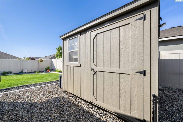 view of shed with a fenced backyard