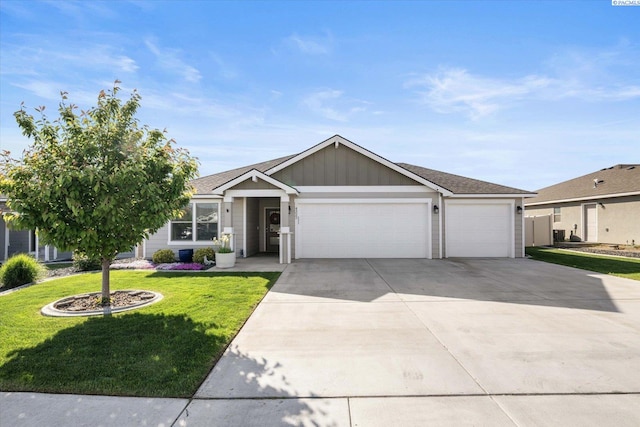 ranch-style house with a garage, board and batten siding, driveway, and a front lawn