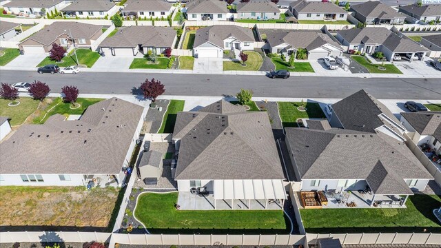 birds eye view of property with a residential view