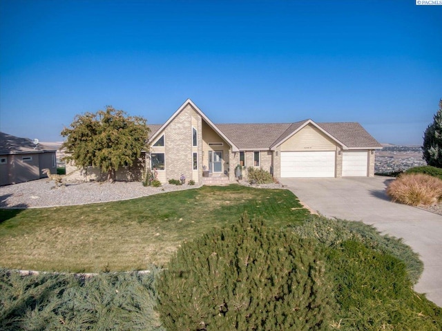 view of front of home featuring a garage and a front yard