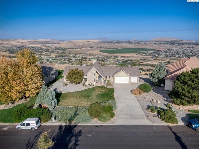 drone / aerial view featuring a mountain view