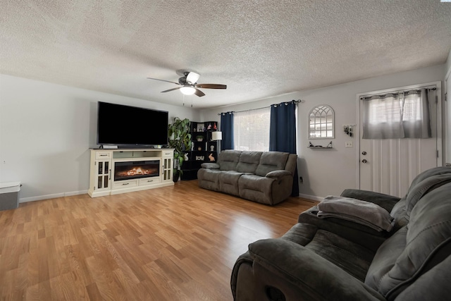 506 W 19th Ave, Kennewick, WA 99337 - living room with ceiling fan, a textured ceiling, and light wood finished floors