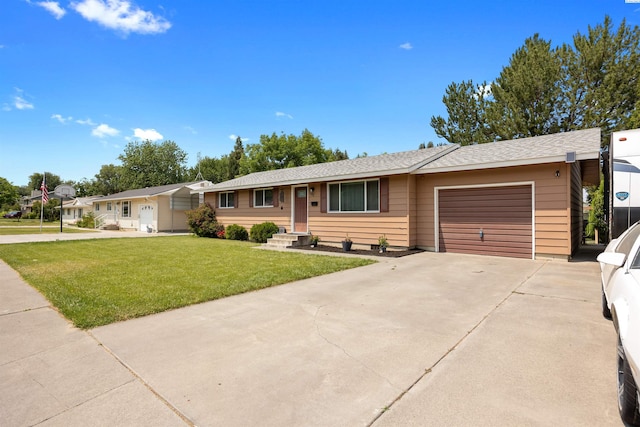 506 W 19th Ave, Kennewick, WA 99337 - ranch-style home with a garage, driveway, and a front lawn