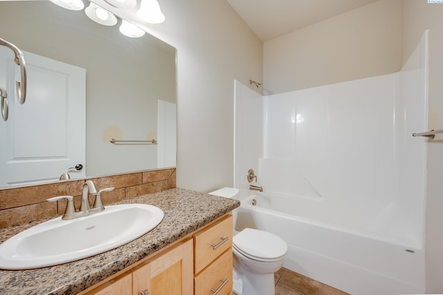 full bathroom with vanity, toilet,  shower combination, and tile patterned flooring