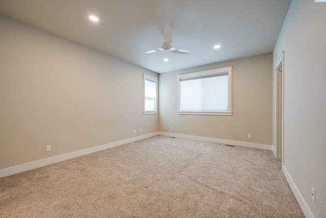 carpeted empty room with ceiling fan