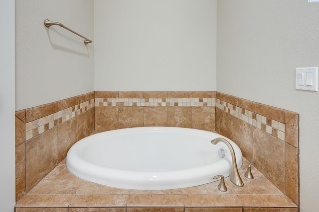 bathroom with a tub to relax in