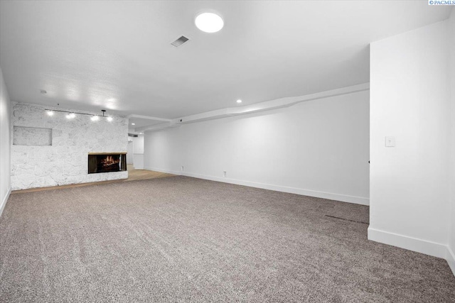 unfurnished living room featuring carpet